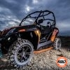 A utv parked on the dirt with nerf bars