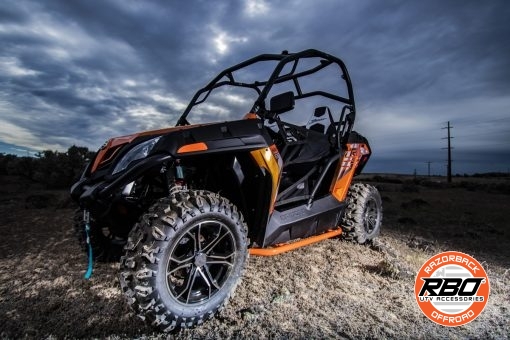 A utv parked on the dirt with nerf bars