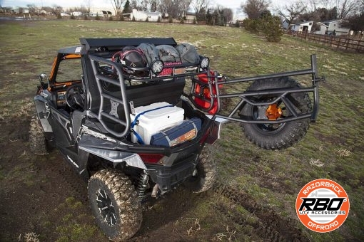 A close up of a UTV rack with Spare tire mounted to tailgate