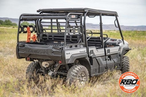 A close up of a UTV rack with Spare tire mount sitting in the grass