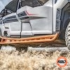 A polaris general parked on a dirt field