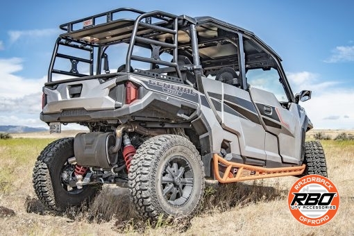 A utv driving down a dirt road