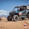 UTV on a rocky hill in front of a mountain