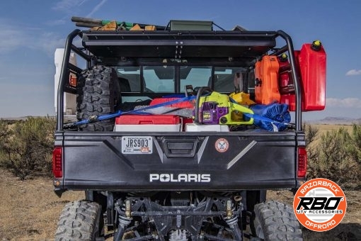 Bed of UTV filled with luggage