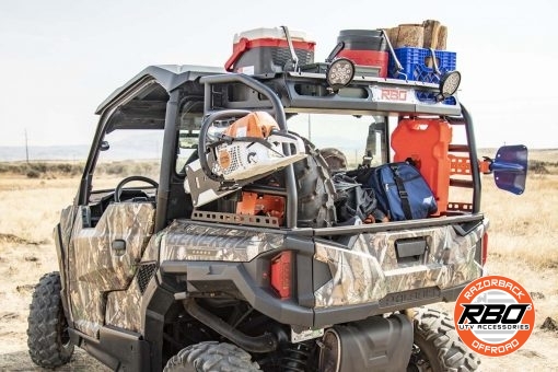 UTV filled with gear in front of dry grass