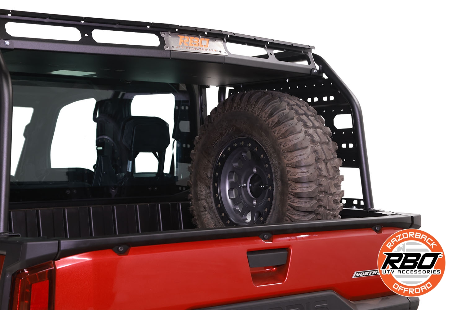 Razorback Offroad Spare Tire Mount installed in cargo area of Polaris Ranger XD 1500, with spare tire mounted.